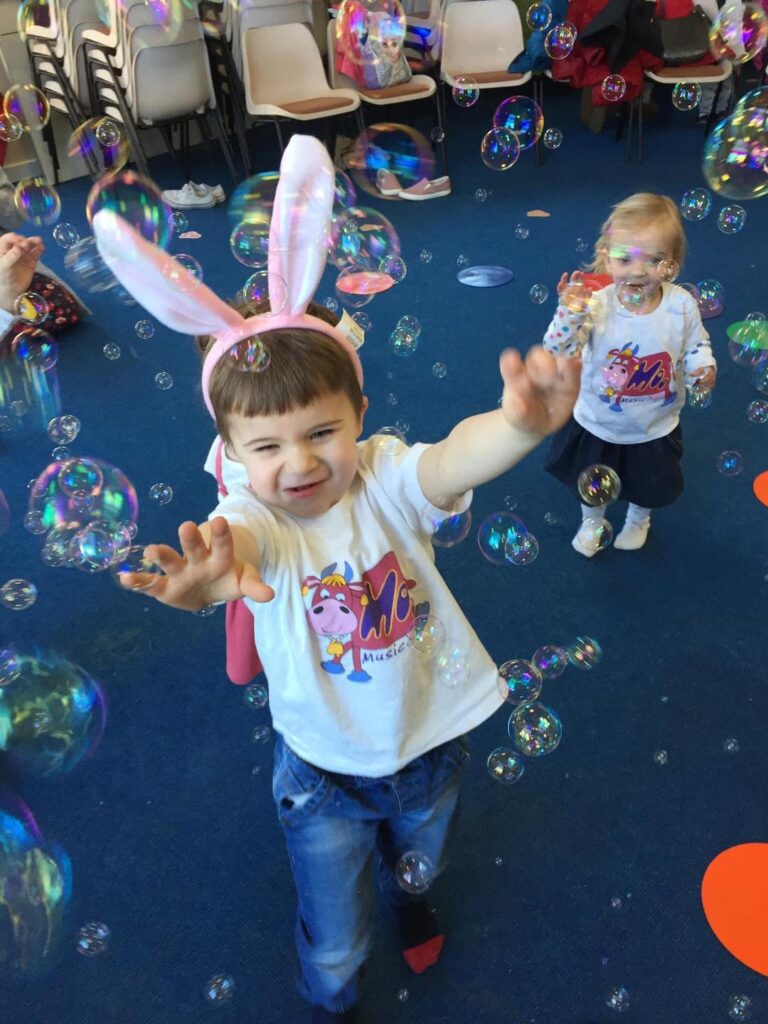 Children enjoying a Moo Music class